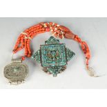 Two Tibetan silver and turquoise Gahu (prayer boxes) one with coral necklace.