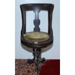 A late 19th century walnut ship's swivel dining chair,