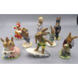 Eight Royal Doulton Bunnykins figures, comprising 'Aussie Surfer DB133', 'Christmas Surprise DB146',