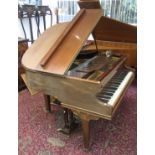 A mahogany cased Berry of London baby grand piano, on square tapering supports.