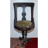 A late 19th century walnut ship's swivel dining chair,