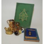 A set of four graduated polished bronze measures, a brass chamber candlestick,