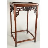 A Chinese hardwood jardinere stand, the square top above a pierced frieze carved with bats,