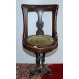 A late 19th century walnut ship's swivel dining chair,