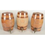 Three stoneware spirit barrels, Port, Sherry and Whiskey, each applied with a Royal Coat of Arms,