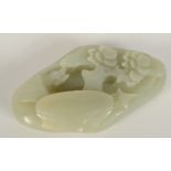 A Chinese jade pebble, carved with a scholar in a mountainous landscape, height 8.3cm.