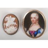 A Victorian painted miniature portrait on porcelain together with a cameo brooch.