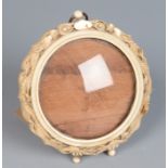 A Chinese ivory circular photograph frame, late 19th/early 20th century,