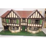 A large Triang dolls house of wood construction with typical tin plate windows throughout,