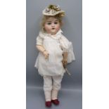 A rare porcelain head doll by Robert Hiller, the head with sleep eyes,