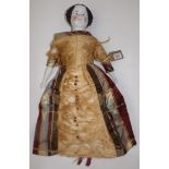 A fashion doll with china shoulder plate head, forearms and legs.
