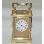 A French brass repeating carriage clock, the white enamel dial inscribed 'Martin & Co, Paris',