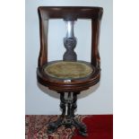 A late 19th century walnut ship's swivel dining chair,