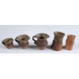 Five miniature studio pottery jugs, largest height 4cm.