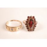 A 9ct gold garnet ring and a 15ct gold ring.