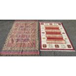 A kelim rug, the square section field decorated with animals, 278 x 187cm and another kelim,