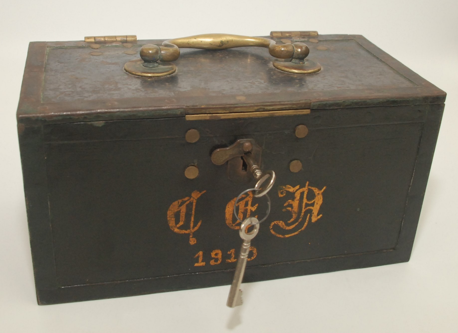 An Edwardian strong box, gilt painted 'C.E.