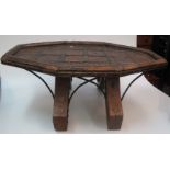 A Middle Eastern hardwood occasional table, the octagonal top on splayed feet, with metal mounts,