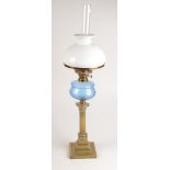 A Victorian 'Solil' brass oil lamp, the blue glass font above a Corinthian column, total height 75.