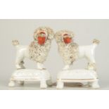 A pair of Staffordshire poodles,