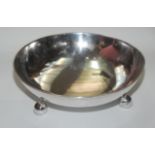 A silver plated circular fruit bowl, with three ball feet, diameter 24.7cm.