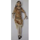 A 1920s or early 30s boudoir doll with moulded face and fabric body, full length 28".