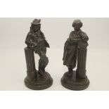 A pair of spelter figures, 19th century, each dressed in classical country attire, height 23cm.