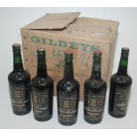 Five bottles of Gilbey's Triple Crown port.