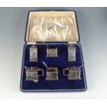 A Mappin & Webb plain Art Deco six piece silver cruet together with four mating spoons 9.