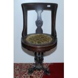 A late 19th century walnut ship's swivel chair, the vertical splat carved with an intertwined P & O,