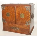 An Edwardian oak smokers cabinet,