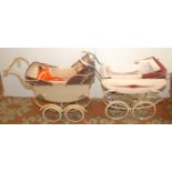 A 1950/1960s Royale twin pram, the wood body with leather cloth canopies,