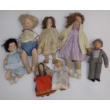 Seven miscellaneous fabric dolls each with moulded face,