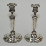 A pair of filled silver candlesticks with detachable nozzles, height 20.5cm.