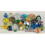 A collection of twenty six miscellaneous glass paperweights, including Murano and millefiori.