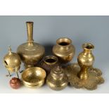 A selection of middle eastern brassware, including a silver and copper inlaid Cairoware vase,