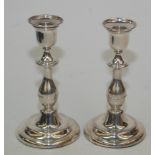 A pair of modern filled silver baluster candlesticks with detachable nozzles, height 19.5cm.