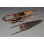 A middle eastern steel Katar, in a wooden sheath, length 26cm, and an African tribal dagger,