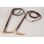 Two leather riding whips, each with antler handle, one inscribed 'TO THE REV. J.A. CROFT M.C.