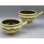 A pair of Clive Bowen Studio Pottery bowls, each with a single rectangular handle,