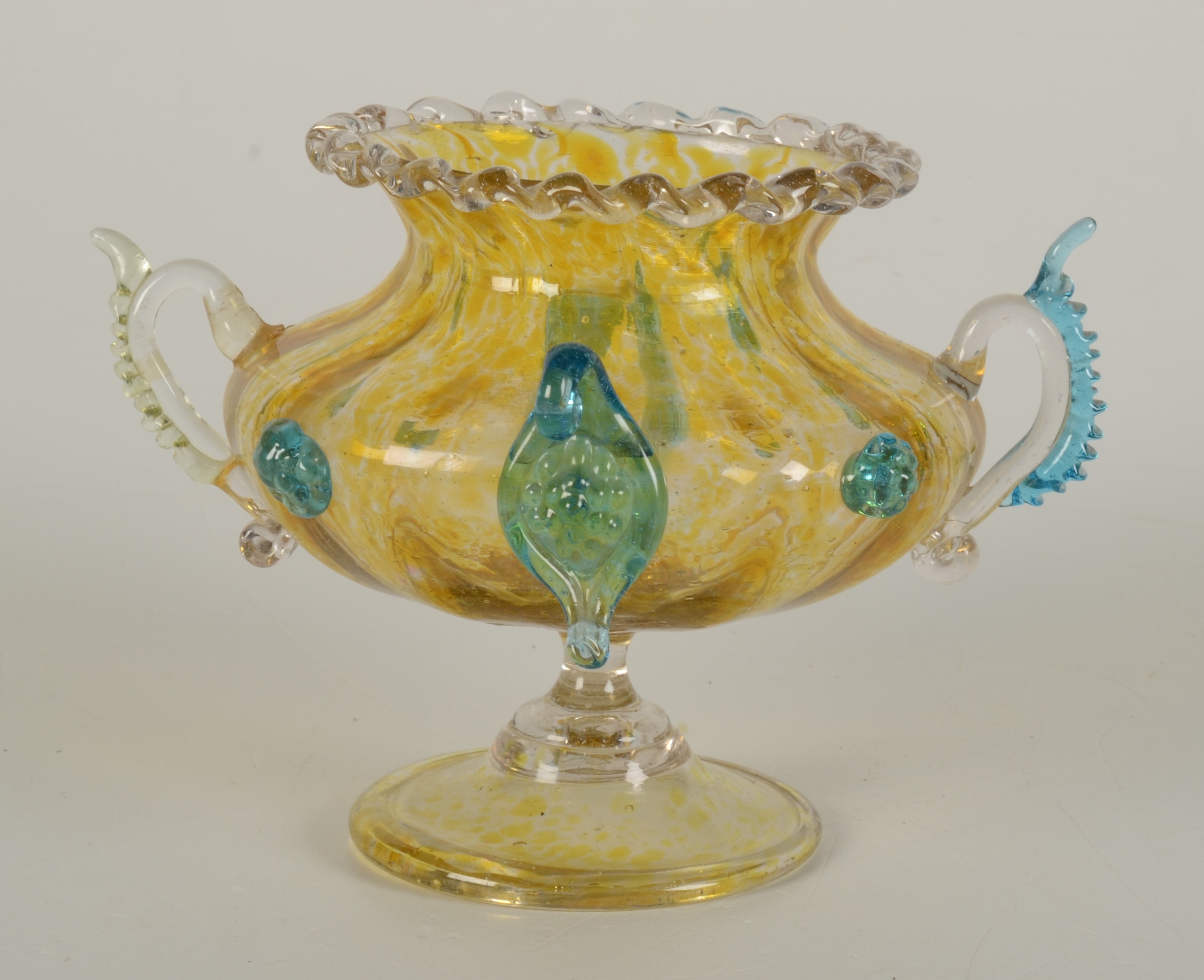 A Venetian yellow glass vase, with twin handles and fluted body on a circular platform base,