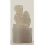 A Chinese carved grey jade model of a dog of fo on a rectangular plinth base, height 5.3cm, width 2.
