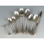 Silver spoons and sugar tongs. 5.4oz. Together with a grapefruit knife with filled silver handle.