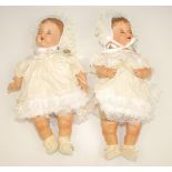 A pair of 1950s composition dolls with fabric torsos each similarly dressed, one full length 25",