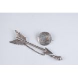 An Aesthetic Movement gold mounted silver brooch together with a Victorian silver arrow brooch