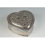A silver Victorian repousse decorated heart shaped box, Sheffield 1889. 3.4oz.