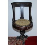 A late 19th century walnut ship's swivel dining chair,