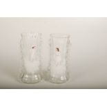 A pair of Mary Gregory glass vases, each painted with a child, height 22.5cm.