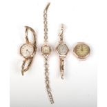 Three ladies gold cased wristwatches and one other.