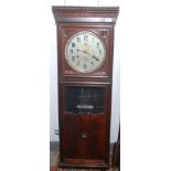 An oak cased clocking in clock, the 25.5cm silvered dial inscribed 'International Time Recording Co.